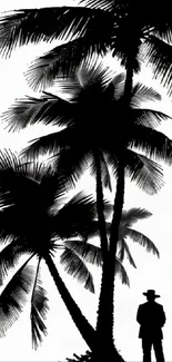 Silhouette of palm trees and a figure in black and white.