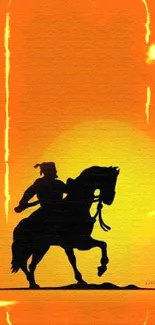 Silhouette of a rider on horseback against an orange sunset.