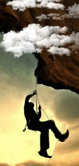 Silhouette of a rock climber against a dramatic, golden sky with clouds.