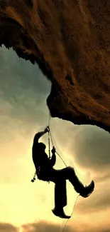 Silhouette of a rock climber against a sunset sky, creating an adventurous scene.