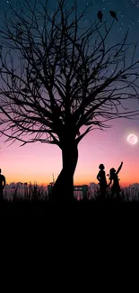 Silhouette of tree and people at twilight with a starry sky.