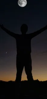 Silhouette of a person under a moonlit night sky, arms raised in tranquility.