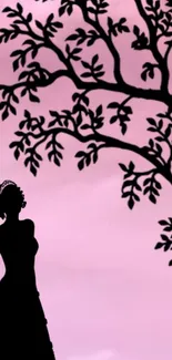 Silhouette of a figure under a pink sky with a tree.