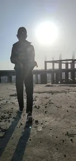 Silhouette walking towards sunset on an urban rooftop with skyline.