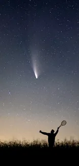 Silhouette under a starry sky with a visible comet.