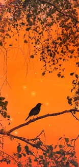 Silhouette of a bird on a branch against an orange sunset sky with tree leaves.