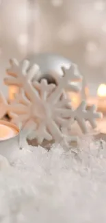 Beautiful silver Christmas ornaments with candles on snowy background.