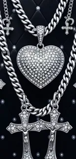 Silver chains with heart and cross pendants on dark background.