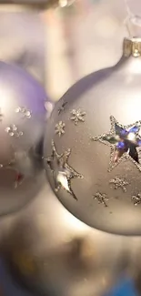 Silver Christmas baubles with bokeh lighting background.