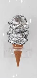 Artistic silver ice cream sculpture on a sleek white background.