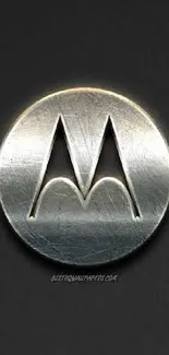 Sleek Motorola silver logo on dark matte background, perfect for phone wallpaper.