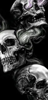 Silver skulls with smoke on dark background.