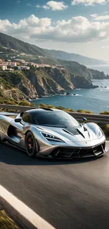 Sleek silver supercar driving on a picturesque coastal road.