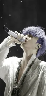 Singer with purple hair performs passionately under spotlight.