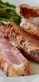 Close-up of juicy grilled steak slices with asparagus.