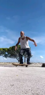 Skateboarder gliding through scenic outdoor landscape with blue sky.