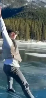 Person ice skating on a frozen lake with mountains in the background.