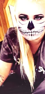 Person with skeleton face makeup in a warm, wooden setting.