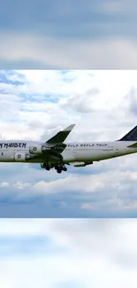 A large airplane flying through bright blue skies with clouds.