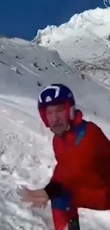 Skier in red outfit on snowy mountain slope.