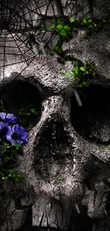 Dark skull wallpaper with purple flowers and cobwebs.