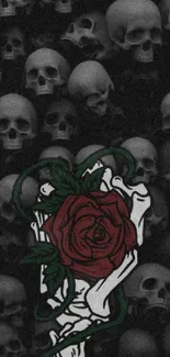 Dark skull pattern with red rose and skeletal hand wallpaper.