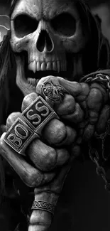 Dark skull with 'Boss' ring and chains, gothic wallpaper.