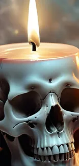Illuminated skull-shaped candle against dark background.