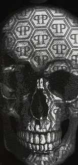 Intricate skull design on black wallpaper with hexagonal patterns.