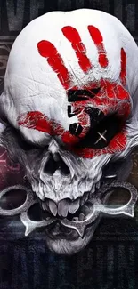 Skull with red handprint art on dark background.