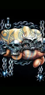 Tattooed fist with skull rings on black background wallpaper.