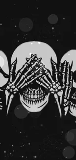 Dark skull trio mobile wallpaper with gothic elements.