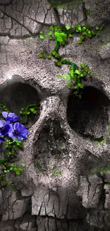 Skull with green vines and purple flowers on cracked surface.