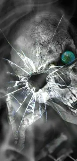 Grayscale skull with cracked glass effect, featuring a vivid blue eye.