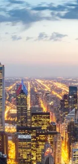 City skyline at dusk with glowing lights and twilight sky.