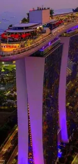 Marina Bay Sands illuminated with city lights at night.