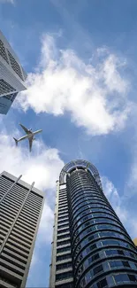 A dynamic view of skyscrapers and a plane against a blue sky.