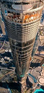 Aerial view of a modern skyscraper with urban landscape.