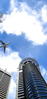 Skyscraper with airplane against blue sky