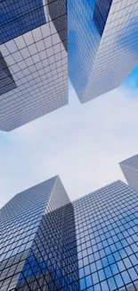 Mobile wallpaper featuring blue sky and towering skyscrapers with reflective glass facades.