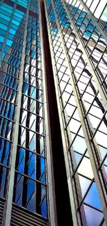 Vertical view of reflective blue skyscraper architecture.