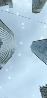 Upward view of skyscrapers reaching into a cloudy sky.