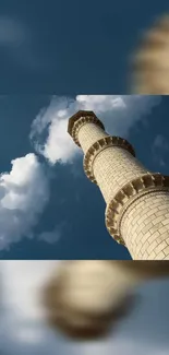 Minaret against a vivid blue sky with clouds.