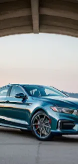 Sleek blue luxury car under a bridge background.