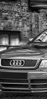 Black and white Audi car in urban setting, stylish and elegant.