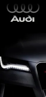 Sleek black Audi car wallpaper with headlight focus.