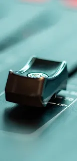 Close-up of a sleek audio mixer fader.