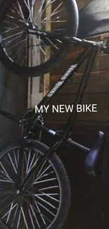 Sleek bicycle in a rustic garage setting with dark wood tones.