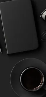 Minimalist black wallpaper with coffee cup and notebook.