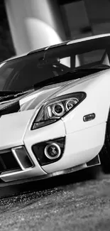 Monochrome sports car with sleek design in black and white for mobile wallpaper.